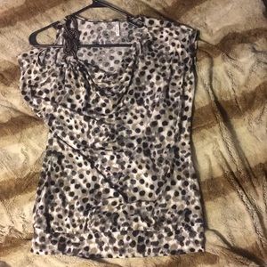 Spotted dressy top with off the shoulder accent